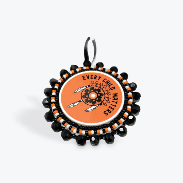 Emily Spencer: Keychain - Round Every Child Matters